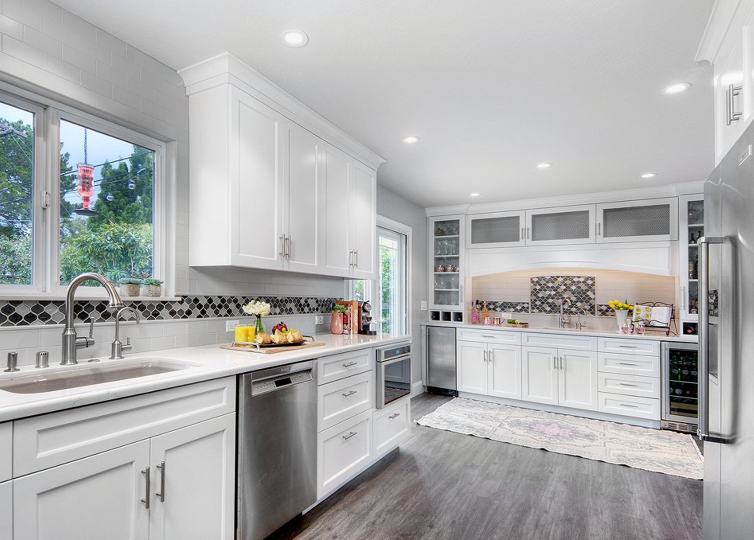 Bright white cabinets in a kitchen remodel usher in much needed light