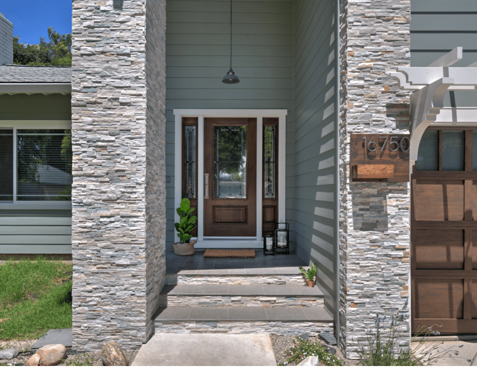 A modern exterior remodel with custom lighting and a selection of complementary textures