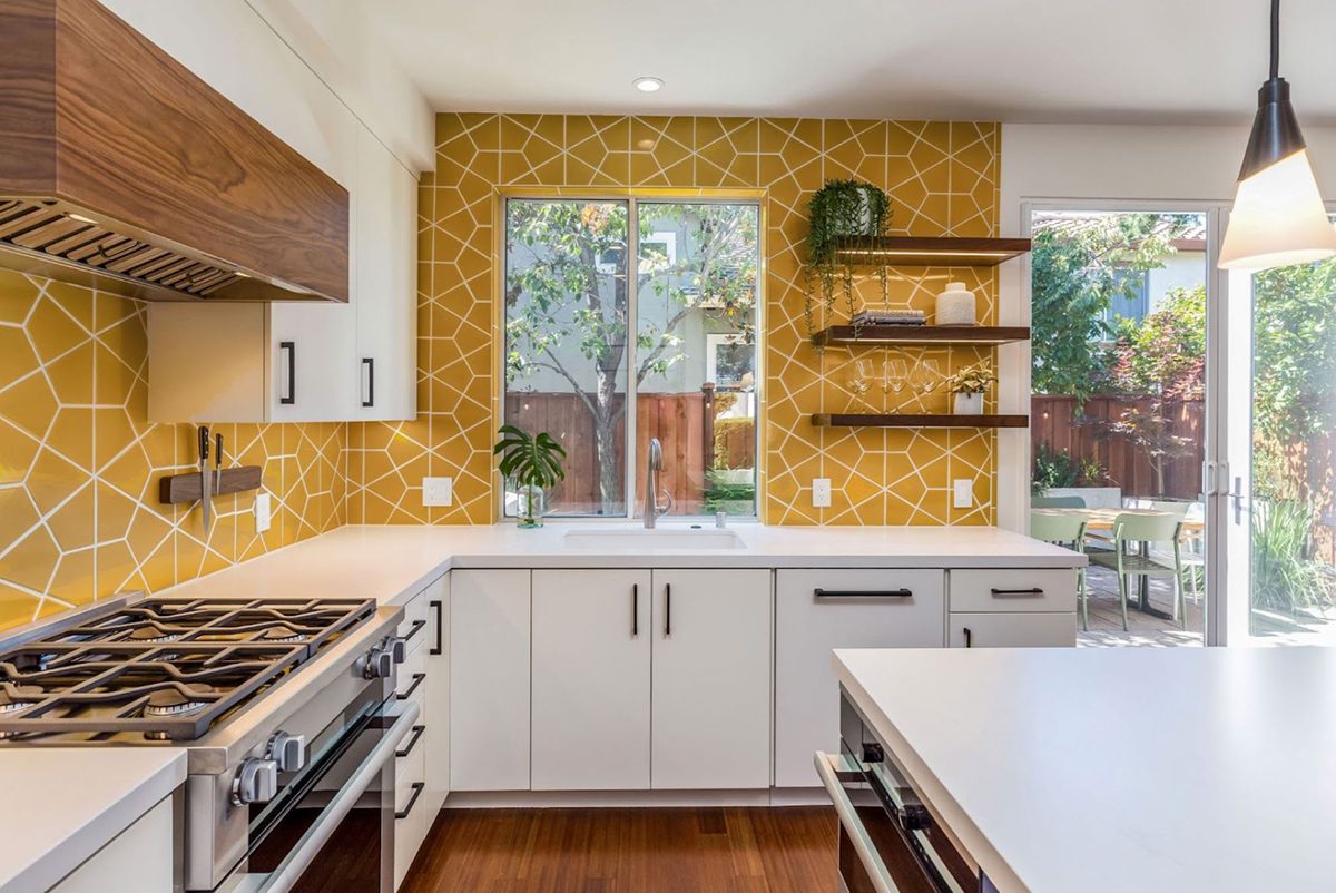 this strategically placed tile adds a bright and happy background to this newly remodeled kitchen