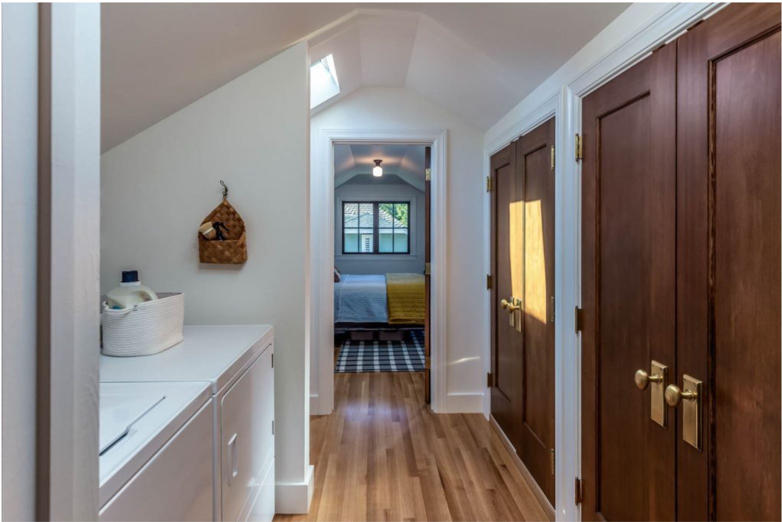 open sightlines create a direct flow from the bedroom to the newly remodeled bathroom
